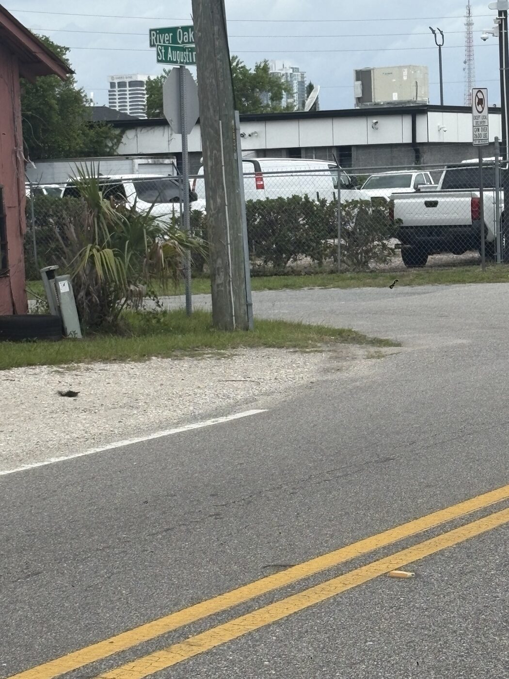 River Oaks Rd & St. Augustine Rd corner with downtown skyline behind